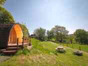 Outdoor seating in front of the pods