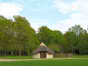 Roundhouse backed by trees