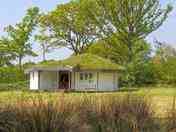 Roundhouse surrounded by greenery
