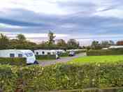 Peaceful setting with coastal views from some touring pitches