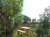 Individual grass pitches with picnic benches