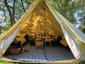 The Hive 5m Bell Tent, with four bed set up and woodfired burner.