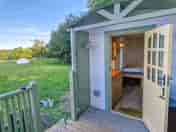 Shepherd's hut decking area, looking at front door of hut (added by manager 21 Jul 2023)