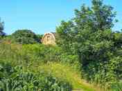 The pod seen from the stream valley (added by manager 23 Sep 2022)