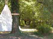 Tipi on a shady pitch