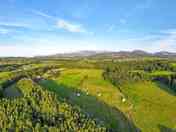 Aerial view of the site, with Eryri National Park and Yr Wyddfa