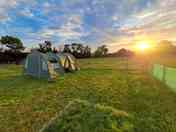 Tent pitch with sunrise