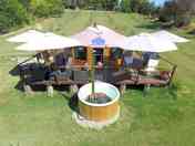 Shaded outdoor deck and hot tub