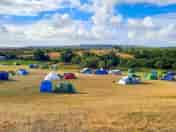 A view across the campsite, with Corfe Castle in the distance (added by manager 26 Aug 2022)
