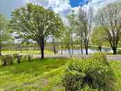 Grass pitch with lake view