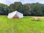 Outside of bring your own bedding bell tent.