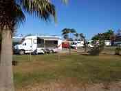 Open grass pitch with optional electricity for caravans and motorhomes