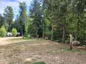 Full service tent site with 15 amp power, water, picnic table, and firepit