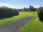 Hardstanding pitch with grass area to the side