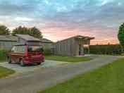 Sunset behind one of the hard-standing pitches and the washup/laundry block