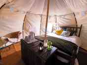 Luxury glamping bell tents, furnished with a comfortable double bed and various cosy amenities
