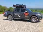 Campsite for parked vehicles and rooftop tents