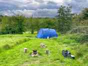 Looking down the slope to the six-person tent pitch