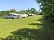 Peaceful pitches by a small fishing lake