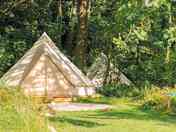 Beautiful 5m bell tent with 4 camp beds. Private garden area with picnic table and a small fire pit.