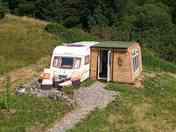 Nestled in a wildflower meadow next to Clocaenog Forest.