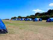 Our pre-erected tents give you space to park, bbq, kids to play and have a campfire