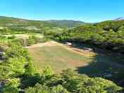 Aerial view of the pitches surrounded by greenery