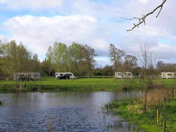 Powered grass tent site