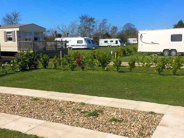 Electric optional gravel and hardstanding touring caravan pitch