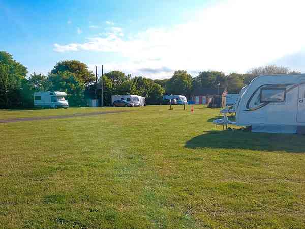 Powered grass travel trailer site