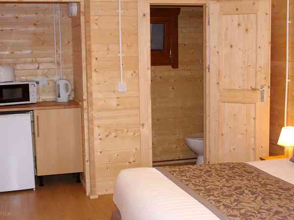The deluxe cabin has an ensuite toilet with wash basin The deluxe cabin has an ensuite toilet with wash basin