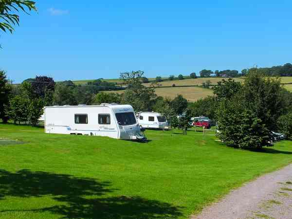 Fully serviced hardstanding touring pitch with waste disposal and water Fully serviced hardstanding touring pitch with waste disposal and water