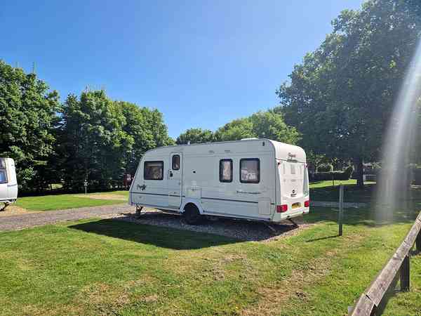 Power optional cement/asphalt and grass travel trailer site