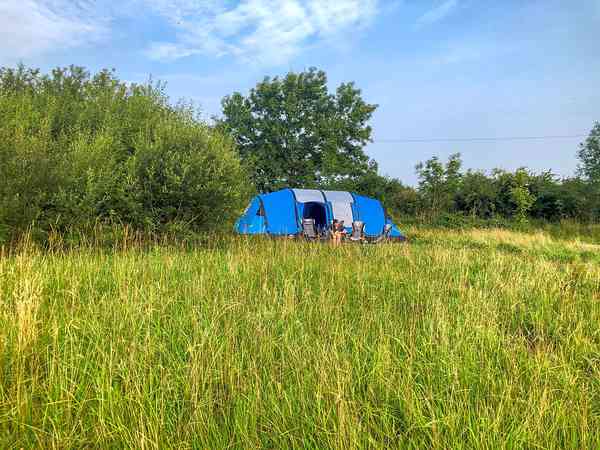 Primitive grass tent or trailer tent site