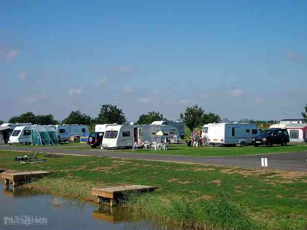 Powered grass tent or caravan site