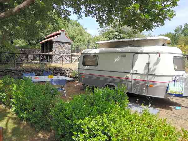 Electric hardstanding and grass touring caravan pitch