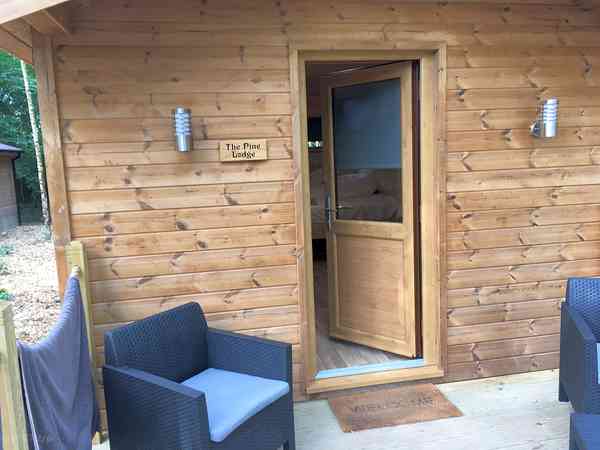 Out side lodge with table & chairs provided Out side lodge with table & chairs provided