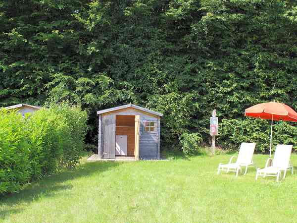 The premium pitch with a small shed and a fridge The premium pitch with a small shed and a fridge