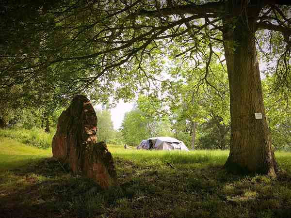 Non-electric grass and earth tent pitch
