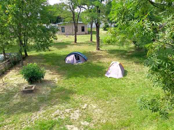 Power optional concrete and grass tent site