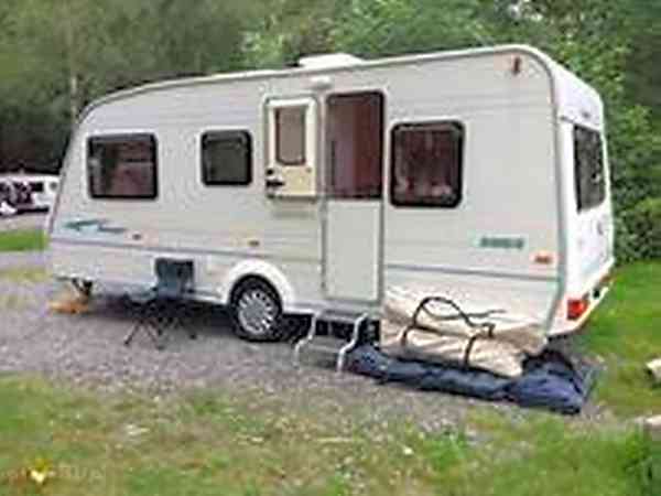 Electric optional grass and earth touring caravan pitch