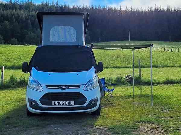 Powered grass and earth motorhome site