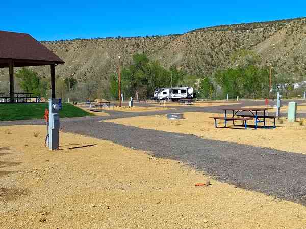 Fully-serviced gravel and hardstanding touring pitch (deluxe, large, pull-thru)