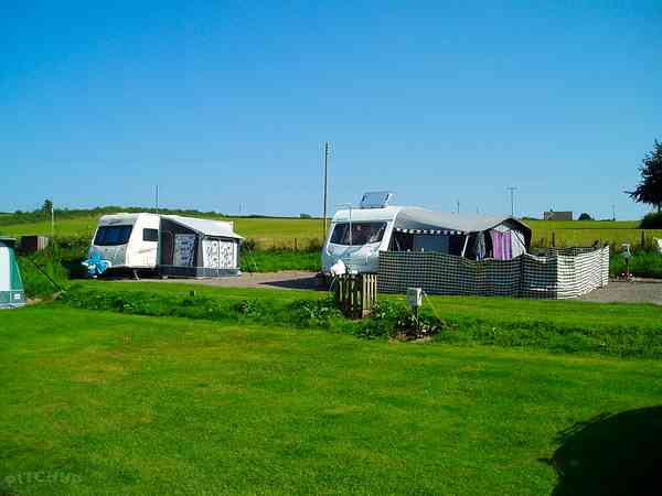 Electric grass and gravel tent or trailer tent pitch