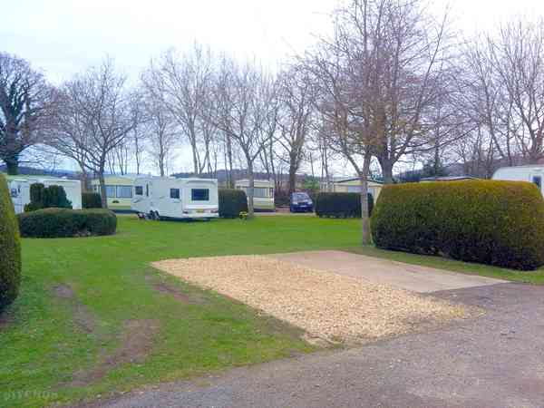 Our touring pitches with gravel and grass Our touring pitches with gravel and grass