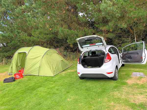 Silver non-electric grass tent or trailer tent pitch