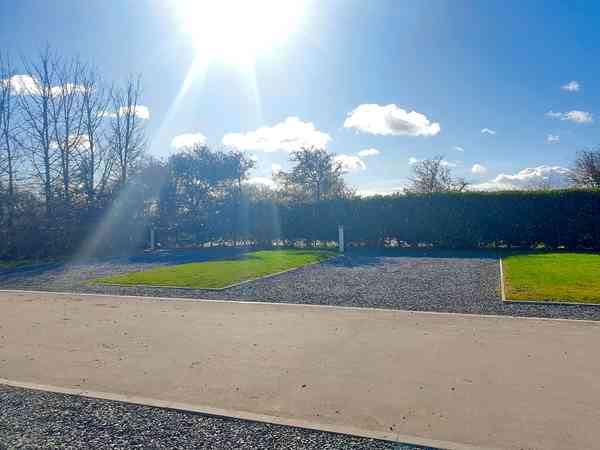 Fully-serviced hardstanding and grass touring pitch