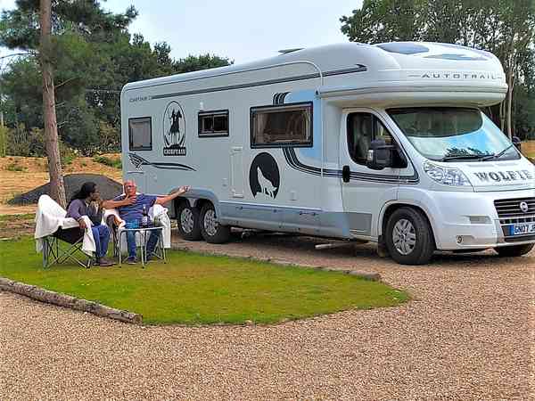 Powered cement/asphalt and grass travel trailer site