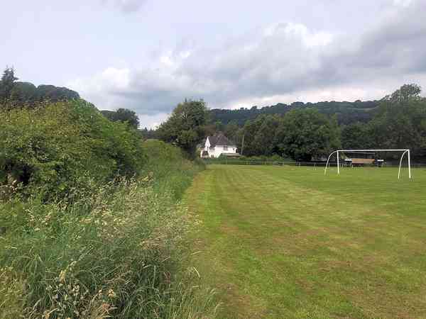 Non-electric hardstanding and grass pitch