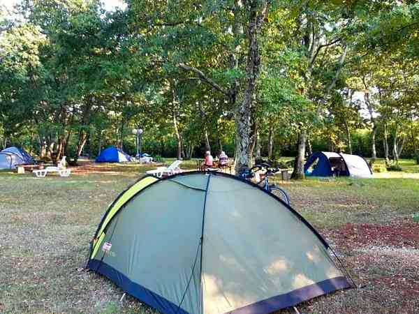 Non-electric grass and earth tent pitch